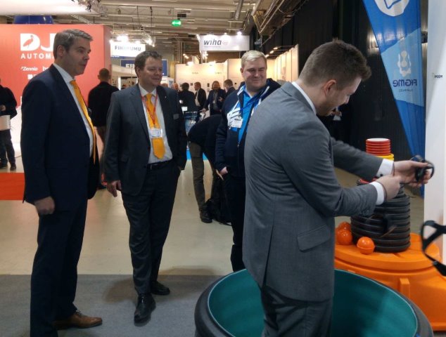 Frank Dahl (left), Benjamin Echtermann (right) & Andreas Bettermann from OBO join Markus Eronen, for a demonstration of virtual reality at his company’s stand at the fair